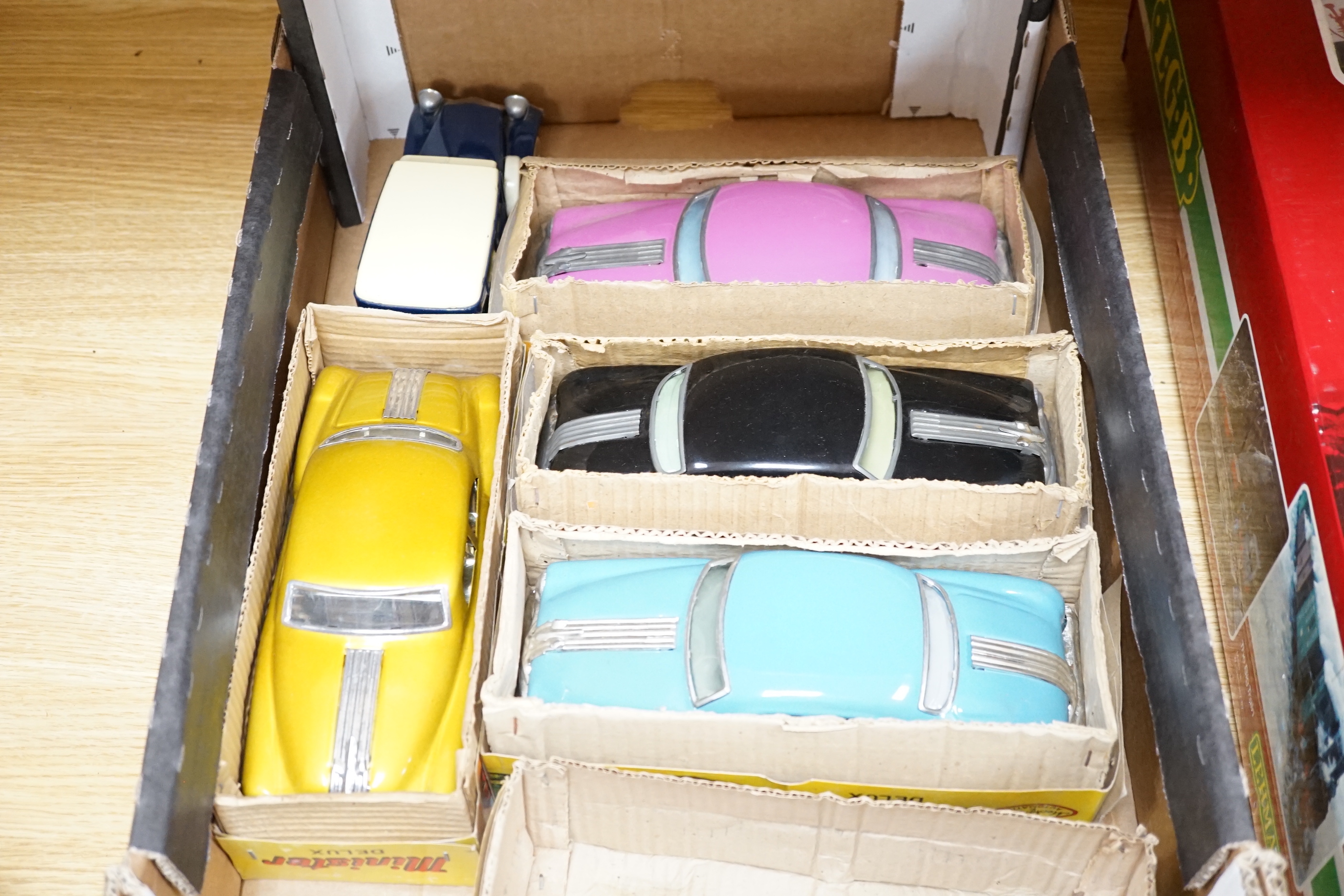 Eight Tinplate cars including; five Minister Deluxe Pontiac tinplate friction drive cars by Amar Toys, India, plus three others